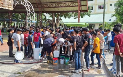 <p><strong>WATER RATIONING</strong>. Personnel of the Bureau of Fire Protection deliver water in Barangay Nalasin, Solsona, Ilocos Norte on April 24, 2024. Solsona town has been placed under state of calamity due to drought. <em>(Photo courtesy of BFP Solsona)</em></p>