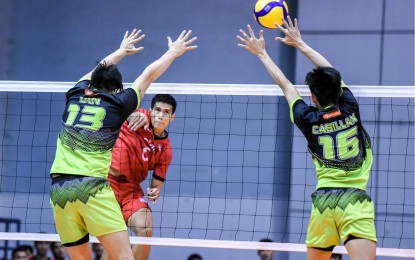 <p><strong>WINNER. </strong>Cignal's Mark Frederick Calado (No. 6) scores off Maverick's Kim Tan (No. 13) and Jethro Cabillan (No. 16) during the Spikers’ Turf Open Conference eliminations at the Ynares Sports Arena in Pasig City on Friday (April 26, 2024). The HD Spikers won, 25-20, 25-9, 25-12. <em>(PVL photo)</em></p>