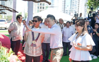 <p><strong>NEW INVESTMENT.</strong> President Ferdinand R. Marcos Jr. (in sunglasses) gets a briefing from Megaworld Corporation president and chief executive officer Kevin Tan at the capsule-laying ceremony of the Mactan Expo Center in Lapu-Lapu City, Cebu on Saturday (April 27, 2024). The President vowed government support for the continued development of the province. <em>(PCO)</em></p>