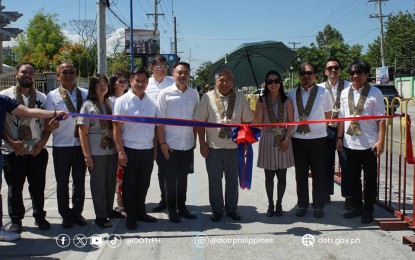 <p><strong>INAUGURATION.</strong> Department of Transportation (DOTr) Secretary Jaime Bautista (middle) and other DOTr and local government officials pose for a photograph during the inauguration of the 'Active Transport Infrastructure' bike lane network in San Fernando, Pampanga on Monday (April 29, 2024). Bautista urged national and local traffic enforcement units to properly enforce traffic laws surrounding bike lanes to help encourage their use.<em> (Photo courtesy of DOTr)</em></p>