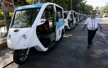 <p><strong>ON STANDBY.</strong> Hundreds of e-tricycles are on standby outside the Manila City Hall on Monday (April 29, 2024) in case of stranded commuters. Transport and labor groups started a three-day nationwide strike to protest the public utility vehicle modernization program. <em>(PNA photo by Yancy Lim)</em></p>