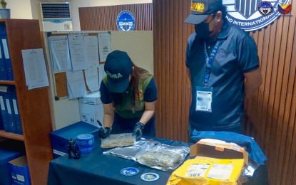<p><strong>BUSTED.</strong> Customs officers account for kush and vape pens containing cannabis oil discovered in five parcels at the Central Mail Exchange Center on April 26, 2024. The BOC on Monday (April 29, 2024) said the shipments were declared as seat covers, coffee mugs, and books.<em> (Photo courtesy of BOC-NAIA)</em></p>