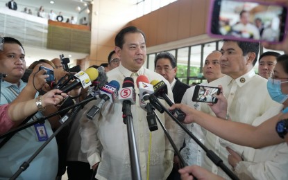 <p><strong>RICE PRICES.</strong> Speaker Martin Romualdez (center) answers questions from the media during an ambush interview at the House of Representatives on Tuesday (April 30, 2024). Romualdez said the House is eyeing to amend the Rice Tariffication Law to bring down the price of rice by PHP10 to PHP15 per kilo. <em>(Photo courtesy of the House Press and Public Affairs Bureau)</em></p>
