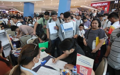 <p><strong>JOB HUNTERS</strong>. Applicants line up for an interview at the jobs fair of the Pasay government and the Department of Labor and Employment during the Labor Day celebration at the Music Hall, Mall of Asia in Pasay City on May 1, 2024. The Philippine Statistics Authority said the number of unemployed Filipinos as of end-March 2024 was at two million. <em>(PNA photo by Avito Dalan)</em></p>