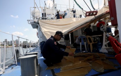 <p><strong>DAMAGE ASSESSMENT.</strong> Philippine Coast Guard personnel on Thursday (May 2, 2024) assess the damage sustained by BRP Bagacay following a water cannon attack by a Chinese Coast Guard vessel near Bajo de Masinloc. Initial assessment has found damage in the ship's superstructure, with further assessments looking into the structural integrity of the ship. <em>(PNA photo by Yancy Lim)</em></p>