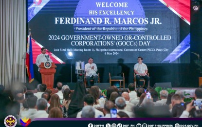 <p><strong>GOCC DAY</strong>. President Ferdinand R. Marcos Jr., Executive Secretary Lucas Bersamin (middle) and Finance Secretary Ralph Recto lead the Government-Owned- or Controlled Corporations (GOCCs) Day celebration in Pasay City on Monday (May 6, 2024). The GOCC Day aims to acknowledge the top-remitting GOCCs that significantly contributed dividends to the national government. <em>(Photo courtesy of DOF)</em></p>