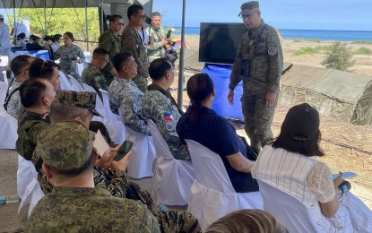 <p><strong>JOINT MILITARY EXERCISES</strong>. 'Balikatan' 2024 executive agent Col. Michael Logico briefs observers of the joint exercises at the La Paz sand dunes in Laoag City on Monday (May 6, 2024). The exercises will culminate with a maritime strike on May 8. <em>(Photo by Leilanie Adriano)</em></p>