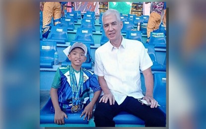 <p><strong>SPECIAL CHAMP.</strong> Negrense Zach Lucas Obsioma, 10, para-swimming triple winner in the 2024 Western Visayas Regional Athletic Association meet, poses with Negros Occidental Governor Eugenio Jose Lacson at Panaad Park and Stadium in Bacolod City on Monday (May 6, 2024). Obsioma will next see action in the Cebu City Palarong Pambansa in July. (<em>Photo courtesy of Mavet Arcillas Obsioma)</em></p>