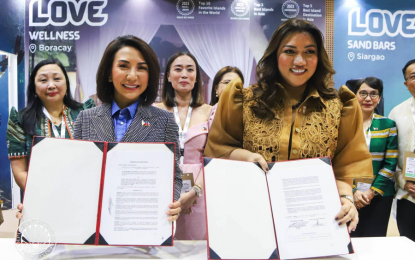 <p><strong>MOU SIGNING.</strong> Tourism Secretary Christina Garcia Frasco and Megaworld Hotels & Resorts Managing Director Cleofe Albiso lead the signing of a Memorandum of Understanding to establish more Muslim-friendly properties in the Philippines on the sidelines of the Arabian Travel Market 2024 on Monday (May 6, 2024) in Dubai, United Arab Emirates. Frasco has positioned the country as a Muslim-friendly destination through a "listening session" with tourism players from the Middle East. <em>(Photo courtesy of DOT)</em></p>