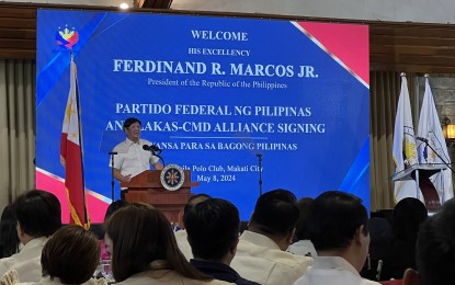 <p><strong>CONTINUED UNITY</strong>. President Ferdinand R. Marcos Jr. speaks at the signing of the alliance between his political party, Partido Federal ng Pilipinas and Lakas - Christian Muslim Democrats at the Manila Polo Club in Makati City on Wednesday (May 8, 2024). In his speech, Marcos called for continued unity and collaboration among government officials and agencies. <em>(PNA photo by Darryl John Esguerra)</em></p>