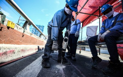 <p><strong>FLYOVER REHAB.</strong> The EDSA-Kamuning flyover southbound in Quezon City undergoing retrofitting and rehabilitation works in this May 9, 2024 photo. The Department of Public Works and Highways-National Capital Region said the flyover might be reopened to traffic in late August if good weather conditions would persist. <em>(PNA photo by Joan Bondoc)</em></p>