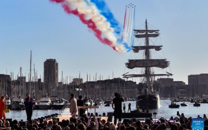 <p><strong>OLYMPIC FLAME</strong>. The three-masted ship Belem carrying the Olympic flame of Paris 2024 arrives at the Vieux-Port (Old Port) as the French Air Force elite acrobatic flying team "Patrouille de France" (PAF) flies over during a ceremony in Marseille, southern France on May 8, 2024. The torch relay will start on Thursday. <em>(Photo by Julien Mattia/Xinhua)</em></p>