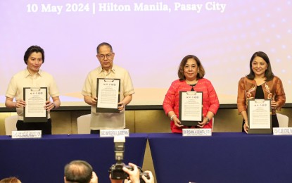 <p><strong>BOOSTING EMPLOYABILITY.</strong> Education Undersecretary Michael Poa, Labor and Employment Secretary Bienvenido Laguesma, Technical Education and Skills Development Deputy Director for Policies and Planning Rosanna Urdaneta, and Commission on Higher Education Commissioner Ethel Valenzuela (left to right) enter a joint memorandum circular to provide free certification assessment to all Senior High School – Technical Vocational Livelihood (SHS-TVL) Track graduates at the Hilton Manila in Pasay City on Friday (May 10, 2024). The JMC intends to boost the employability of senior high school graduates. <em>(PNA photo by Robert Oswald Alfiler)</em></p>