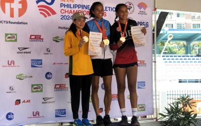 <p><strong>DOUBLE GOLD.</strong> Sarah Dequinan of Bukidnon (center) poses with Far Eastern University's Angelyn Ortiz (left) and Bohol's Diana Rysiamie Huraño during the awarding ceremony of the long jump event of the ICTSI Philippine Athletics Championships at PhilSports in Pasig City on Friday (May 10, 2024). Dequinan also ruled the women's heptathlon on May 9. <em>(Contributed photo)</em></p>