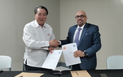 <p><strong>ASIAN YOUTH WEIGHTLIFTING IN PH.</strong> The Philippines will host the Asian Youth and Junior Weightlifting Championships from Nov. 4-14, 2024 at the Ninoy Aquino Stadium inside the Rizal Memorial Sports Complex. Samahang Weightlifting ng Pilipinas President Monico Puentevella (left) and Asian Weightlifting Federation Secretary General Mohammed Ahmed Al Harbi of Saudi Arabia shake hands after signing the memorandum of agreement during a press conference at the Philsports Multi-Purpose Arena in Pasig City on Friday (May 10, 2024). <em>(PNA photo by Jean Malanum)</em></p>