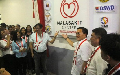 <p><strong>OPENING. </strong>Department of Agrarian Reform Secretary Conrado Estrella III (left, showing the marker) and Senator Christopher Lawrence Go lead the unveiling of the marker of the Malasakit Center at Conrado F. Estrella Regional Trauma and Medical Center in Rosales, Pangasinan on Friday (May 10, 2024). It is the second Malasakit Center in Pangasinan and the 165th in the country. <em>(Photo courtesy of DOH-CHD-1) </em></p>