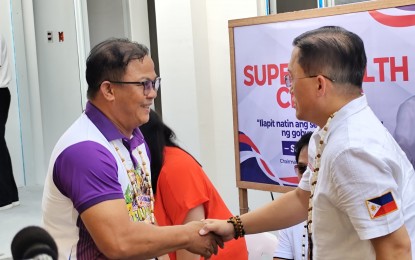 <p><strong>SUPER HEALTH CENTER</strong>. Senator Lawrence "Bong" Go meets with Calauan, Laguna Mayor Osel Caratihan at the site of a "super health center" in the town on Sunday (May 12, 2024). The lawmaker took part in an inspection of the soon-to-open facility.<em> (PNA photo by Zen Trinidad)</em></p>