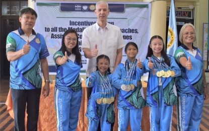 <p><strong>MEDALISTS.</strong> Negros Occidental Governor Eugenio Jose Lacson (center) and DepEd-Negros Occidental Schools Governance and Operations Division chief Romeo Sison Sr. (left) with the most bemedaled athletes and their coaches in the just-concluded Western Visayas Regional Athletic Association Meet 2024. On Monday (May 13, 2024), Lacson distributed cash incentives worth PHP1.5 million to student-athletes from Negros Occidental in rites held at the Capitol Social Hall in Bacolod City. <em>(Photo courtesy of PIO Negros Occidental)</em></p>