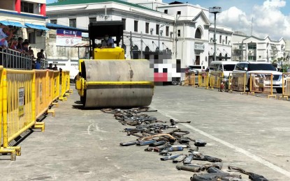 <p><strong>DESTROYED.</strong> A roller compactor destroys 157 modified mufflers in a ceremony in front of the Dinagyang grandstand in Iloilo City on Friday (May 17, 2024). The city government launched an intensified campaign against modified mufflers that emit deafening noise in March this year. <em>(PNA photo by PGLena)</em></p>