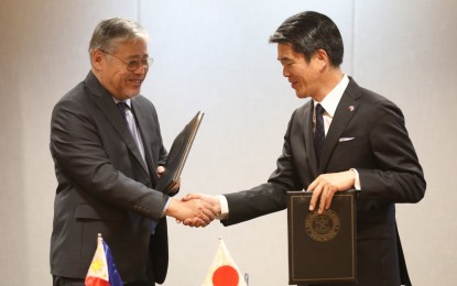 <p><strong>MORE PATROL VESSELS.</strong> Department of Foreign Affairs Secretary Enrique Manalo and Japan Ambassador to the Philippines Endo Kazuya shake hands after the signing of the Exchange of Notes for the Maritime Safety Capability Improvement Project Phase III and the Project For Human Resource Development Scholarship 2024 at the DFA Office in Pasay City on Friday (May 17, 2024). The procurement of multi-role response vessels will be financed by a JPY64.38 billion Japanese official development assistance loan. <em>(PNA photo by Avito Dalan)</em></p>