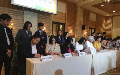 <p><strong>CONTRACT SIGNING</strong>. Eight students from different academic institutions in Baguio City and La Trinidad, Benguet who are enrolled in tourism-related courses sign the memorandum of agreement for the one-year scholarship grant being extended by the Hotel and Restaurant Association of Baguio, at the Baguio Country Club on Wednesday (May 22, 2024). The group has initially budgeted PHP1 million for its scholarship program. <em>(PNA photo by Liza Agoot)</em></p>