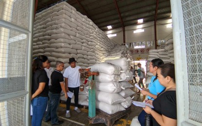 <p><strong>STOCKPILE INVENTORY</strong>.  Personnel of the National Food Authority (NFA) in Bicol region conduct the 1st semester physical inventory of palay in a warehouse in this undated photo. The agency on Wednesday (May 22, 2024) said its palay procurement this month has so far exceeded their target by 442 percent<em>. (Photo courtesy of NFA Bicol)</em></p>