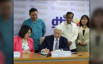 <p><strong>IRR SIGNING</strong>. Department of Trade and Industry Secretary Alfredo Pascual (seated) signs the implementing rules and regulations (IRR) of the Tatak Pinoy Act at the DTI office in Makati City on Wednesday (May 22, 2024). The signing was witnessed by DTI Undersecretary Rafaelita Aldaba (seated), (standing from left to right) Senator Sonny Angara, National Economic and Development Authority Secretary Arsenio Balisacan, and DTI Assistant Secretary Leonila Baluyot. <em>(Photo courtesy of DTI)</em></p>