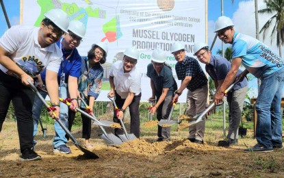 <p><strong>FIRST IN PH</strong>. Officials break ground for the country's first mussel glycogen production plant at the University of the Philippines (UP) Tacloban future campus in Sta. Elena village in Tacloban City. UP President Angelo Jimenez highlights the plant's potential to commercialize mussel glycogen to aid farmers frequently affected by red tide.<em> (Photo courtesy of UP Tacloban)</em></p>