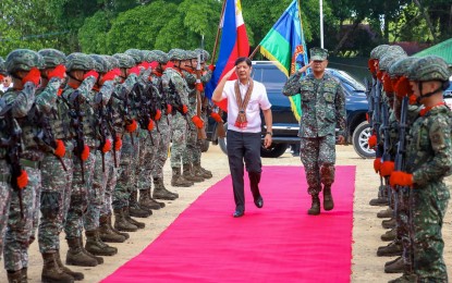 <p><strong>SALUTE.</strong> President Ferdinand R. Marcos Jr. salutes troopers of the Joint Task Force (JTF) - Tawi-Tawi during his visit to its headquarters in Bongao town on Thursday (May 23, 2024). Marcos made history by being the first Filipino president to visit the JTF headquarters in Tawi-Tawi. <em>(Photo courtesy of the Presidential Communications Office)</em></p>