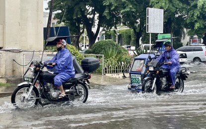 <div dir="auto"><strong>RAINY SEASON</strong>. Trike drivers in Laoag City, Ilocos Norte make their way through a flooded street along Paco Roman Street on May 29, 2024. The public is warned to brace for the rainy season. <em>(Photo by Leilanie Adriano)</em></div>