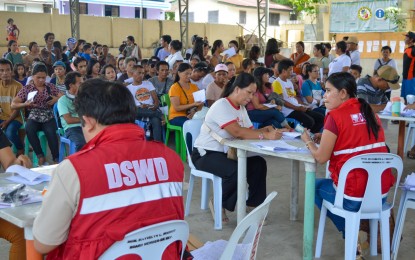 <p><strong>BENEFICIARIES</strong>. Some 400 partner-beneficiaries in San Carlos City, Negros Occidental, receive cash aid of PHP9,000 each under Project LAWA at BINHI of the Department of Social Welfare and Development for drought-hit families on Wednesday (May 30, 2024). The financial assistance was provided through cash-for-training and cash-for-work programs. <em>(Photo courtesy of Negros Occidental-San Carlos City LGU)</em></p>