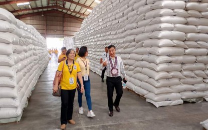 <p><strong>FILLED TO CAPACITY.</strong> National Food Authority (NFA) Administrator Larry Lacson inspects an NFA warehouse filled with palay in Cagayan in this undated photo. Lacson on Friday (May 31, 2024) said the NFA has already reached 97 percent of its target procurement for the first half of the year with still a full month left. <em>(Photo courtesy of NFA Region 2)</em></p>