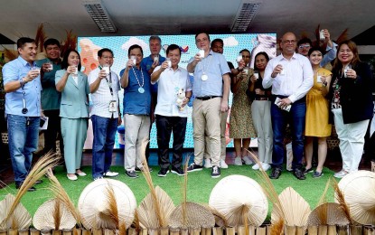 <p><strong>MILK TOAST.</strong> National Dairy Authority (NDA) officials lead the milk toast with other industry stakeholders in celebration of the World Milk Day on Friday (May 31, 2024). The NDA vowed to continue efforts to boost the country's local milk production through importation of dairy herds and genetic improvement.<em> (PNA photo of Ben Briones)</em></p>