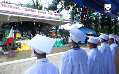 <p><strong>GRADUATES.</strong> Some 34 children in conflict with the law (CICL) residing at the Department of Social Welfare and Development’s (DSWD) National Training School for Boys (NTSB) receive their diplomas for completing senior high school and elementary during a graduation ceremony at the facility in Tanay, Rizal on May 30, 2024. The NTSB provides protection and parental care to CICL to help them through rehabilitation in a residential setting and prepare them for successful adjustment with their family and community after discharge. <em>(DSWD photo)</em></p>