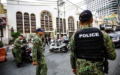 <p><strong>POLICE PRESENCE.</strong> Members of the Manila Police District keep a presence around the busy Minor Basilica of the Black Nazarene in Quiapo on June 3, 2024. Philippine National Police chief Gen. Rommel Francisco Marbil on Wednesday (June 19) ordered that 85 percent of all police personnel nationwide be actively engaged in field duties as part of ongoing efforts to make Filipino communities safer. <em>(PNA photo by Joan Bondoc)</em></p>