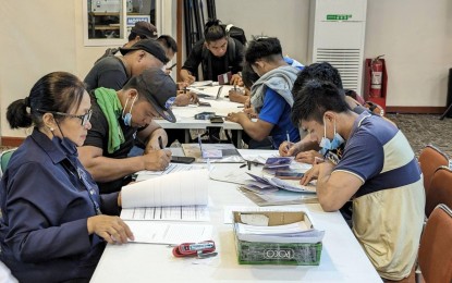 <p><strong>UNPAID.</strong> Some of the 100 Filipino fishers file their complaints against a manning agency at the Department of Migrant Workers head office in Mandaluyong City on Wednesday (June 5, 2024). Their complaints include non-payment of wages, incorrect wage payments, poor working conditions, irregular work hours, and being fed with “expired” food. <em>(Photo courtesy of DMW)</em></p>