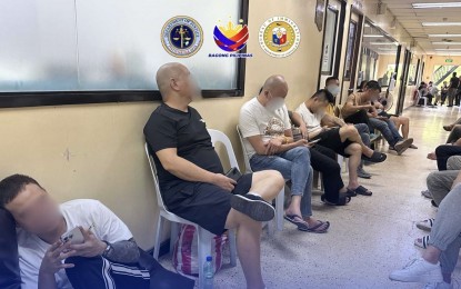 <p><strong>NABBED.</strong> Immigration officers nab 37 Chinese nationals allegedly involved in illegal retail operations in Parañaque City on Tuesday (June 4, 2024). The foreigners were found to be operating businesses without a valid working visa in the country.<em> (Photo courtesy of BI)</em></p>