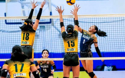 <p><strong>TOPSCORER.</strong> Diza Berayo of National University-Nazareth School (No. 3) tries to score against Nina Macuto (No. 15) and Frenchie Premaylon (No. 15) of Far Eastern University-Diliman at the Adamson University Gym. Berrayo scored 18 points as the Lady Bullpups prevailed, 25-6, 25-23, 25-17, to barge into the semifinal round of the 2024 Shakey’s Girls Volleyball Invitational League. <em>(Shakey's Super League photo)</em></p>