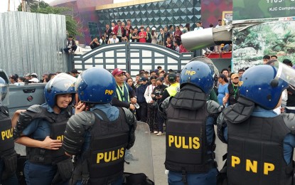 <p><strong>SEARCH CONTINUES.</strong> Units from the Philippine National Police troop to the Kingdom of Jesus Christ (KOJC) compound in Davao City on Monday (June 10, 2024), to serve an arrest warrant against its leader Pastor Apollo Quiboloy. The preacher is facing child abuse and human trafficking charges in Pasig and Davao courts. <em>(PNA photo by Robinson Niñal Jr.)</em></p>