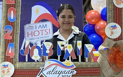 <p><strong>HIRED.</strong> Christine Joy Facturana, 24, of Barangay Buraguis, Legazpi City, was the first applicant hired on the spot during the Kalayaan Job Fair of the Department of Labor and Employment (DOLE) at SM City Legazpi on Wednesday (June 12, 2024). More than 5,000 vacancies were available for job seekers. <em>(PNA photo by Connie Calipay)</em></p>