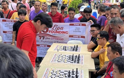 <p><strong>CHESS TOURNEY</strong>. Lipa Mayor Eric Africa joins a simultaneous chess exhibition in Lipa City, Batangas on June 14, 2023. The event was part of the city's 419th Foundation Day. <em>(Contributed photo)</em></p>