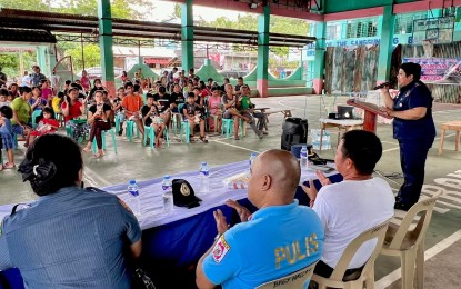 <p><strong>STRONGER RELATIONS</strong>.  Lt. Col. Malu Calubaquib, Police Regional Office-Bicol (PRO5) spokesperson (right), along with other police officers, meets with residents of Barangay San Francisco at the village's multi-purpose hall in Legazpi City on Tuesday (June 18, 2024) as part of the Community Halo-Bilo Project. The project aims to build trust and cooperation with the people.<em> (Photo courtesy of PRO5) </em></p>