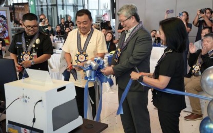 <p><strong>TIGHTER WATCH.</strong> Immigration Commissioner Norman Tansingco (3rd from left) and other officials lead the inauguration of the BI's state-of-the-art document examination laboratory at the Mactan-Cebu International Airport (MCIA) on Wednesday (June 19, 2024). The new equipment provides advanced forensic inspection, including the analysis of watermarks, microprints, and other security features critical in identifying counterfeit documents. <em>(Photo courtesy of BI)</em></p>