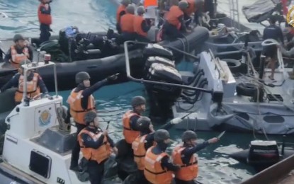 <p><strong>'BARBARIANS'.</strong> China Coast Guard (CCG) personnel point bladed weapons on Filipino troops carrying out a humanitarian rotation and resupply mission to the BRP Sierra Madre in Ayungin Shoal on June 17, 2024. President Ferdinand R. Marcos, on Thursday (June 27) said while the incident cannot be considered an "armed attack," it is a deliberate and illegal action to prevent the Philippine troops from carrying out its mission.<em> (Screengrab from video courtesy of the Armed of the Philippines)</em></p>