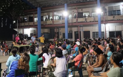 <p><strong>DISPLACED FAMILIES</strong>. Evacuees at St. Vincent High School in La Castellana, Negros Occidental undergo stress debriefing activity with personnel of the Department of Social Welfare and Development and Municipal Social Welfare and Development Office on Tuesday (June 18, 2024). The displaced residents have been seeking shelter in the evacuation center since the eruption of Mt. Kanlaon on June 3, 2024. <em>(Photo courtesy of DSWD-Western Visayas)</em></p>