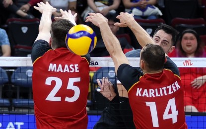 <p><strong>SCORE.</strong> Canadian outside hitter Stephen Timothy Maar scores against Germans Lukas Maase (No. 25) and Moritz Karlitzek (No. 14) in the Men's Volleyball Nations League (VNL) Week 3 at the SM Mall of Asia Arena on Thursday (June 20, 2024). Canada won the match, 25-19, 25-18, 25-21. <em>(Photo courtesy of VNL)</em></p>