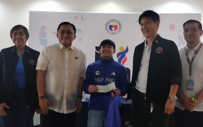 <p><strong>SUPPORT TO ATHLETES. </strong>Senator<strong> </strong>Christopher "Bong" Go (2nd from left)  pose for a photo after handing out PHP500,000 each to athletes who will compete in the Paris Olympics, at the Rizal Memorial Sports Complex on Friday (June 21, 2024). With him are (from left) Philippine Sports Commission (PSC) commissioner Olivia "Bong" Coo, gymnast Carlos Yulo, PSC commissioner Edward Hayco, and PSC executive director Paolo Tatad. <em>(PNA photo by Jean Malanum) </em></p>