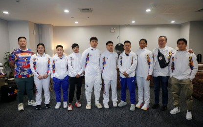 <p><strong>OFF TO METZ.</strong> Philippine Olympic Committee (POC) president Abraham “Bambol” Tolentino (2nd from right) and secretary-general Wharton Chan (left) pose for posterity with 2024 Paris Olympics-bound Filipino athletes at the NAIA Terminal 3 before they leave for Metz, France on Saturday (June 22, 2024). Also in photo are (from left) weightlifters Vanessa Sarno and Elreen Ando, boxers Aira Villegas, Hergie Bacyadan, Carlo Paalam and Nesthy Petecio, rower Joanie Delgaco and weightlifter John Febuar Ceniza who will hold a month-long training camp for Olympics set July 26 to Aug. 11. <em>(Photo courtesy of POC)</em></p>
