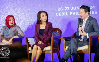 <p><strong>FOOD TOURISM.</strong> Thailand Vice Minister for Tourism and Sports Jakkaphon Tangsutthitham (right) during the ministerial dialogue of the first United Nations (UN) Tourism Regional Forum on Gastronomy Tourism for Asia and the Pacific in Cebu on Wednesday (June 26, 2024). Also in photo (from left) are Martini Paham, Indonesian Deputy Minister for Resources and Institutions at the Ministry of Tourism and Creative Economy, and Philippine Tourism Secretary Christina Garcia Frasco.<em> (Photo courtesy of DOT)</em></p>
