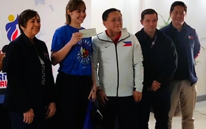 <p style="text-align: left;"><strong>SUPPORT.</strong> Philippine Sports Commissioner Bong Coo (left) and Senator Christopher Lawrence Go (center) lead the handing of cash incentives to the Alas Pilipinas women's volleyball team at the PSC conference hall inside the Rizal Memorial Sports Complex in Malate, Manila on Wednesday (June 26, 2024). The team bagged the bronze medal in the Asian Volleyball Confederation Challenge Cup which the country hosted in May. <em>(PNA photo by Jean Malanum) </em></p>